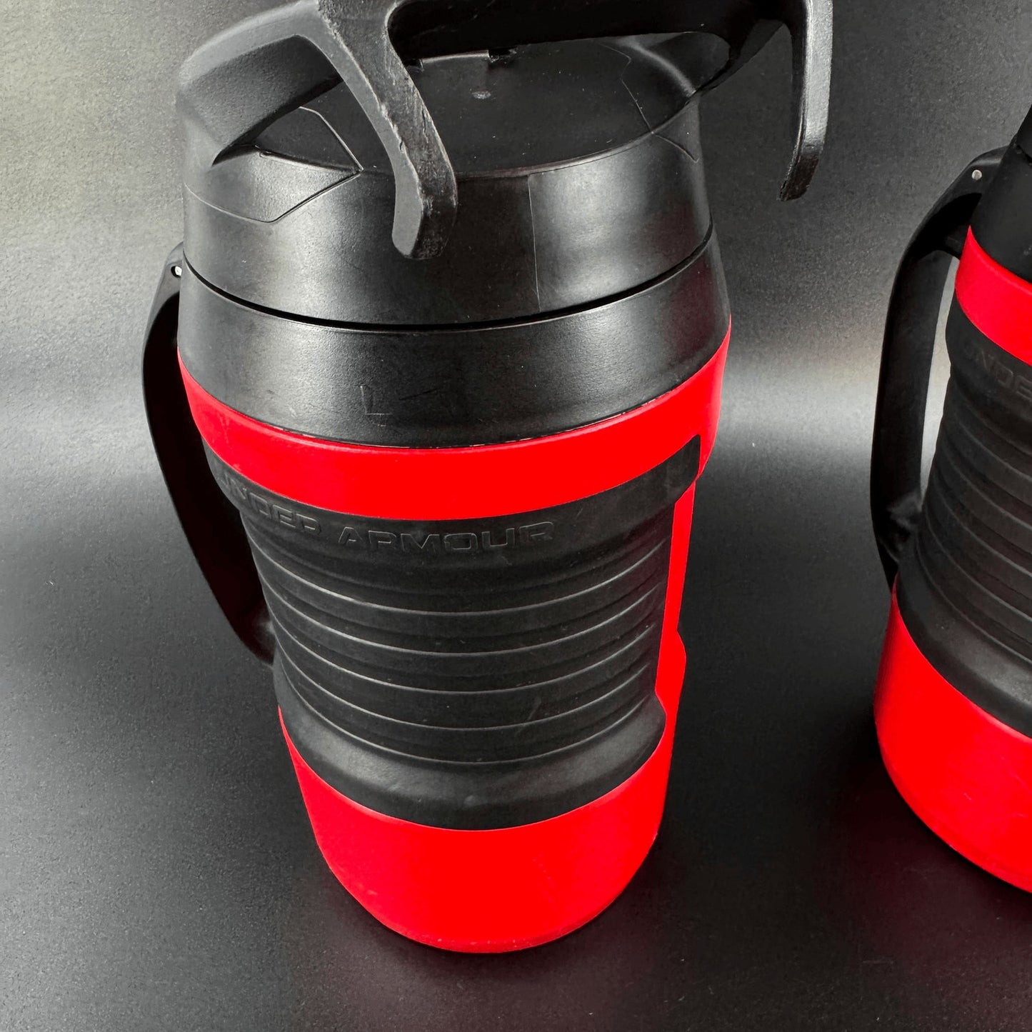 Under Armour Lot of 2 Playmaker Water Jug 64 oz Bottle Red Black w/Fence Hook